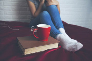 book and hot tea woman hand