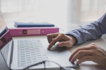 Businessman hands busy using laptop at office desk, young female student typing on computer sitting at wooden table