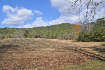 Fototapeta premium Mountains in October Fields are cut hay is stored. 