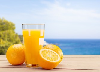 Glass of delicious orange juice on natural