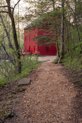 Fototapeta na wymiar Red Mill Barn at end of trail