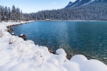 Quiet Cabin On Shoreline of Mountain Lake in Early Winter