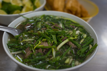 Pho soup with plenty on spring onions