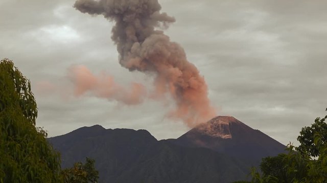 Reventador Volcano erupting at dawn, November 2015. The mountain is situated in a remote part of the Ecuadorian Amazon surrounded by rainforest. Time-lapse.