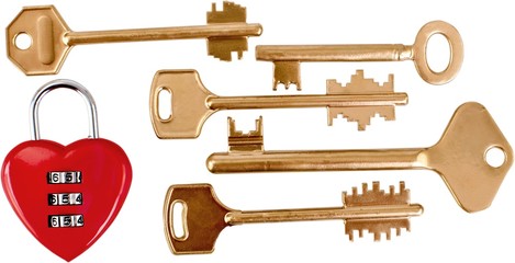 Brass keys and a heart shaped lock - isolated image