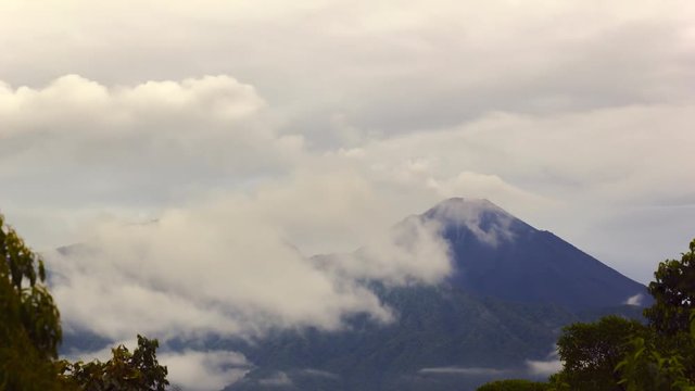 Reventador Volcano erupting, November 2015. The mountain is situated in a remote part of the Ecuadorian Amazon. The rainforest covered slopes in foreground are part of the caldera. Time-lapse.