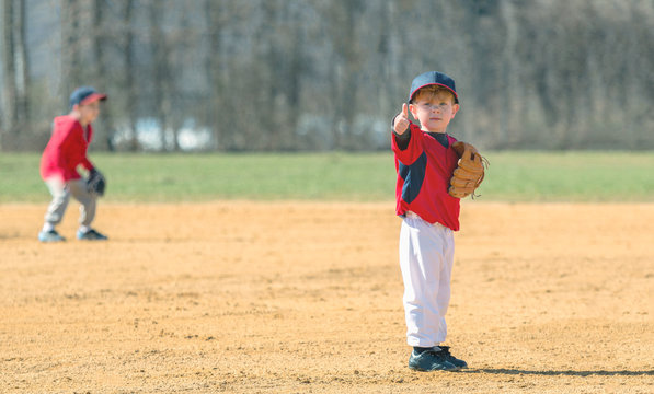 Young Baseball Player Giving a Thumbs Up