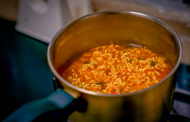 A bowl of rosy Korean noodles
