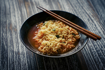 A bowl of rosy Korean noodles