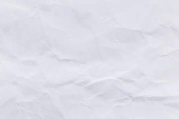 Crumpled white paper background for design.