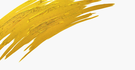Gold brush stroke texture on white background