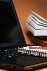 Close-Up of The Laptop and Notebook with Pen