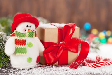 Christmas gift box, candy canes and snowman
