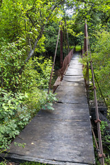 Old suspension footbridge in disrepair outside the Bulgarian Fore-Balkan village of Debnevo
