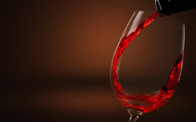 Fototapeta na wymiar Red wine pouring in glass on background