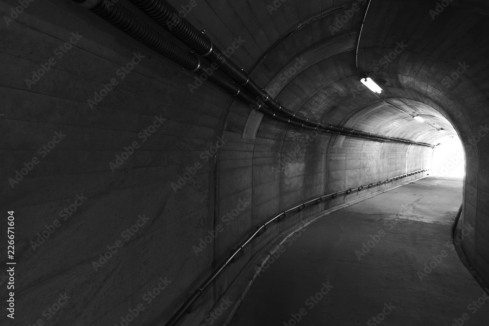 Aufkleber light at the end of stone tunnel