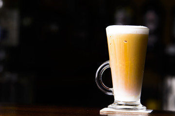 Ice coffe on the bar. Glass of ice coffe.