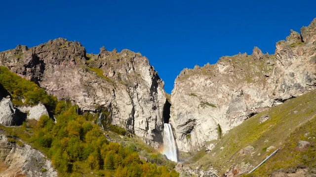Beautifull landscape view of a big waterfall at Caucasus mountains near mount Elbrus - the highest peak in Europe.