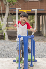 Little boy exercising outdoors