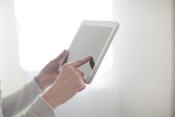 close up.woman's hand pressing on screen digital tablet .photo with copy space