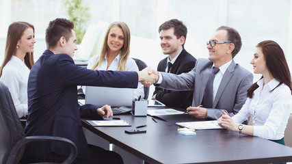 business partners shaking hands after a successful transaction