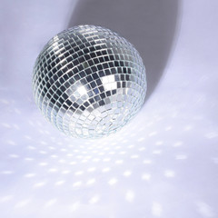 beautiful disco ball on yellow background isolated.