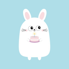 Fototapeta premium White bunny rabbit holding cake with candle. Funny head face. Big eyes. Cute kawaii cartoon character. Baby greeting card template. Happy Birthday sign symbol. Blue background. Flat design.