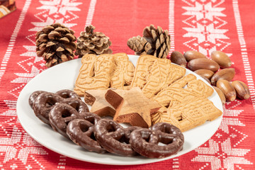 christmas cookies and decorations on a plate