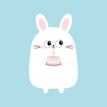 White bunny rabbit holding cake with candle. Funny head face. Big eyes. Cute kawaii cartoon character. Baby greeting card template. Happy Birthday sign symbol. Blue background. Flat design.