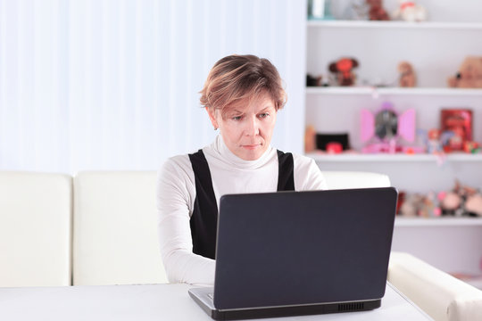 business woman uses laptop to work at home.the concept of freelancing