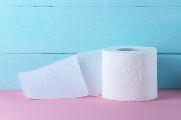 Toilet paper roll on a blue background. Hygiene