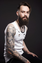 handsome man with beard. Brutal boy with tattoo
