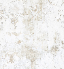 White concrete wall with peeling paint. Grunge background.