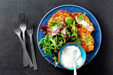 Vegetarian snacks appetizers courgettes fritters healthy breakfast top view