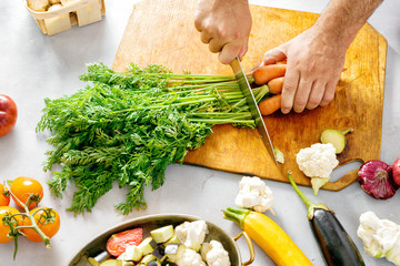 Man hands cuts vegetables cooking vegetable stew Recipe cooking healthy food
