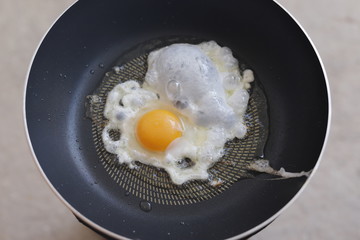 Cooking Fried Egg.