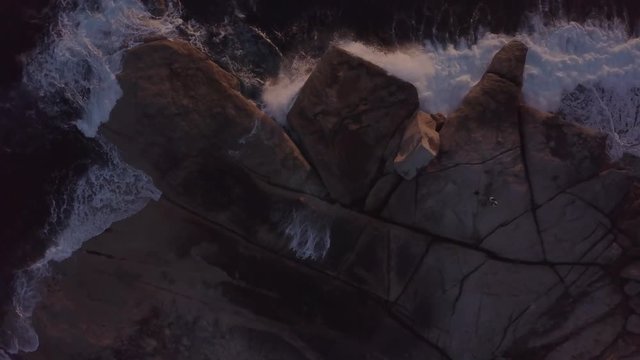 Top down view of Bicheno blowhole in Tasmania at sunrise