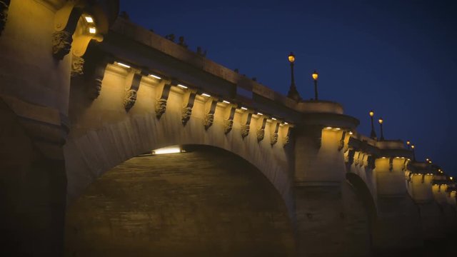 Night bridge on the Seine in Paris, people making photos