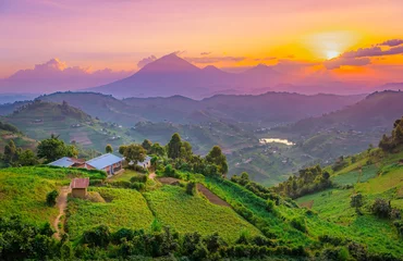 Wall murals Light Pink Kisoro Uganda beautiful sunset over mountains and hills of pastures and farms in villages of Uganda. Amazing colorful sky and incredible landscape to travel and admire the beauty of nature in Africa