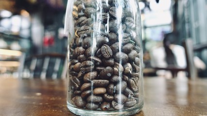 abstract image of a coffee seed in glass cafe and The atmosphere is happy and relaxing with bokeh for background
