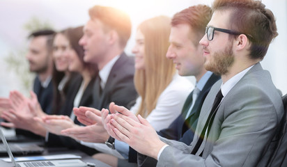 business team applauding the speaker at the meeting