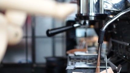 Blurry and soft focus of Asian men Barista using coffee machine in coffee shop counter - Working small business owner food and drink cafe concept
