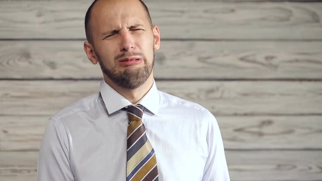 Businessman starting to cry