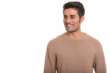 Young handsome Persian man against white background