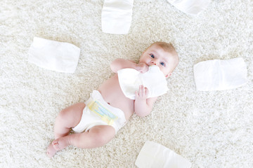 newborn baby girl with diapers. Dry skin and nursery