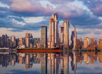 Fototapeta premium New York City, July 24, 2018 Manhattan Midtown skyline at dusk over Hudson River, New York City