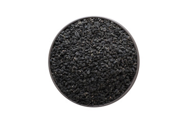 Nigella or Black cumin seeds in clay bowl isolated on white background. Seasoning or spice top view