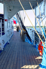 Old Russian sailing ship with old deck superstructures under bright sun