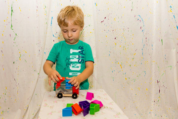 Fototapeta premium a small child plays an educational game
