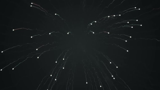 Abstract background with animation of flying fireworks colorful particles light. Animation of seamless loop.